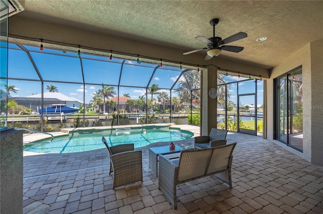 2736 Magdalina Dr, Punta Gorda, FL 33950 - pool featuring glass enclosure, a water view, a patio area, and ceiling fan