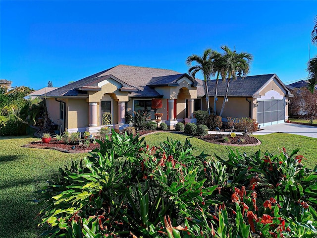 view of front facade with a front lawn and a garage