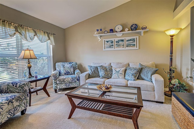 living room featuring lofted ceiling and light carpet