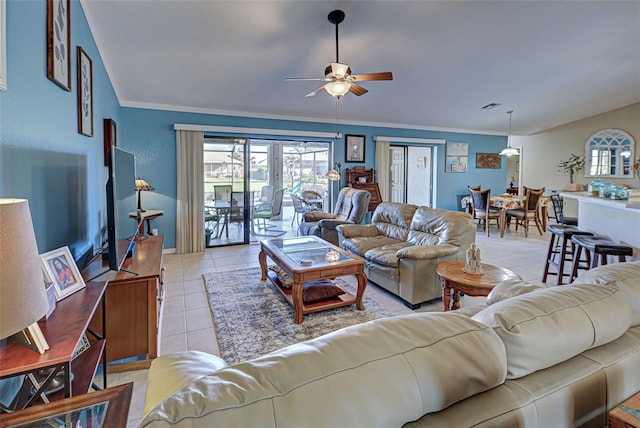 living room featuring crown molding, light tile patterned flooring, and ceiling fan