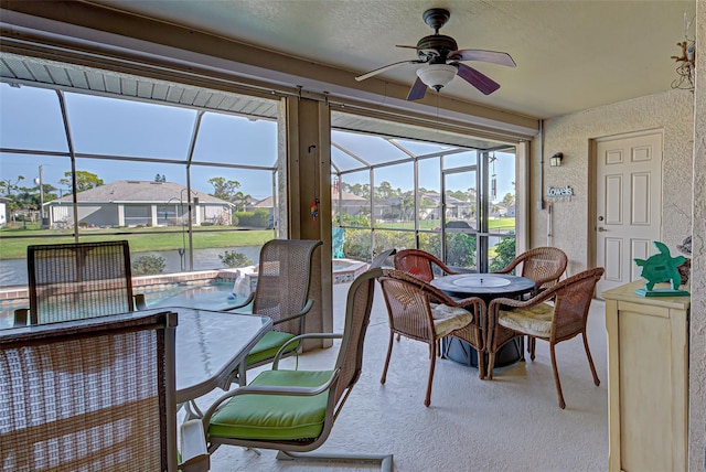 sunroom with ceiling fan and plenty of natural light