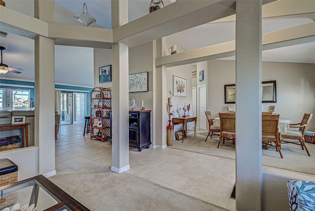 tiled foyer entrance with high vaulted ceiling and ceiling fan