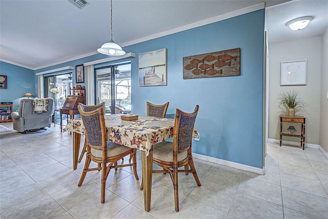 tiled dining room with crown molding