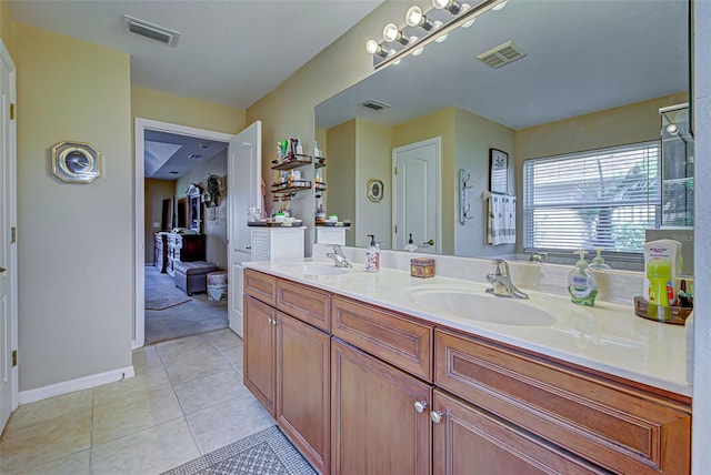 bathroom with vanity and tile patterned flooring