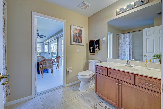 bathroom with tile patterned floors, toilet, a shower with shower curtain, vanity, and ceiling fan