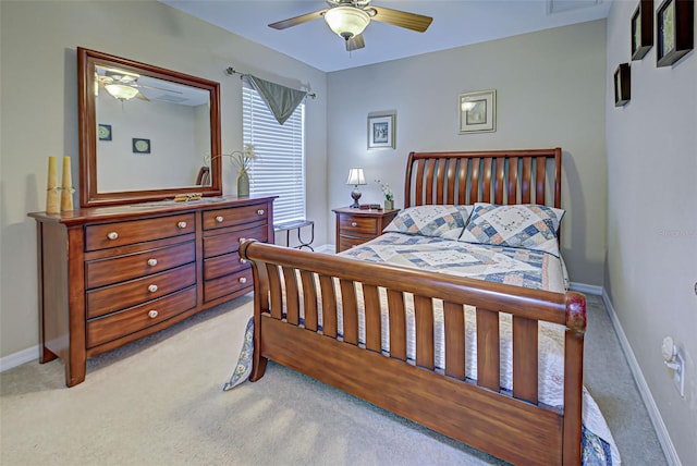 bedroom featuring light colored carpet and ceiling fan