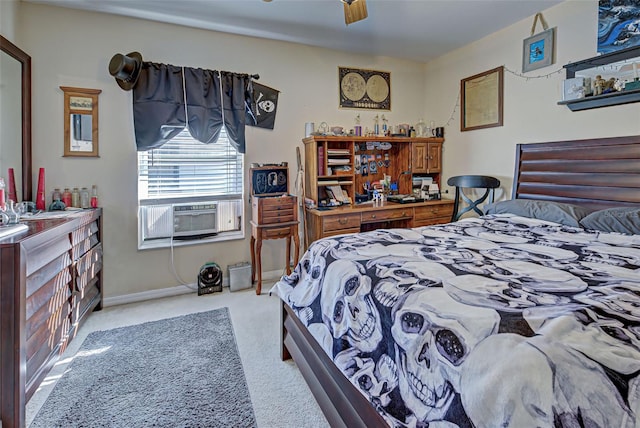 bedroom with cooling unit, light colored carpet, and ceiling fan