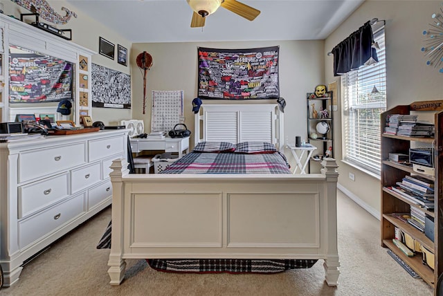 bedroom with light carpet and ceiling fan