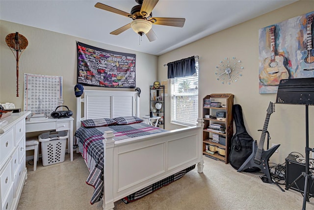 bedroom with light carpet and ceiling fan