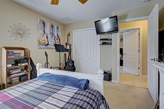 carpeted bedroom with a closet and ceiling fan