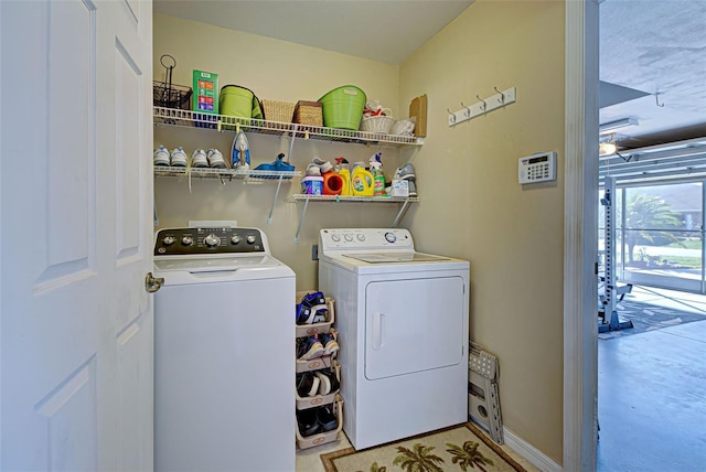 washroom featuring washing machine and clothes dryer