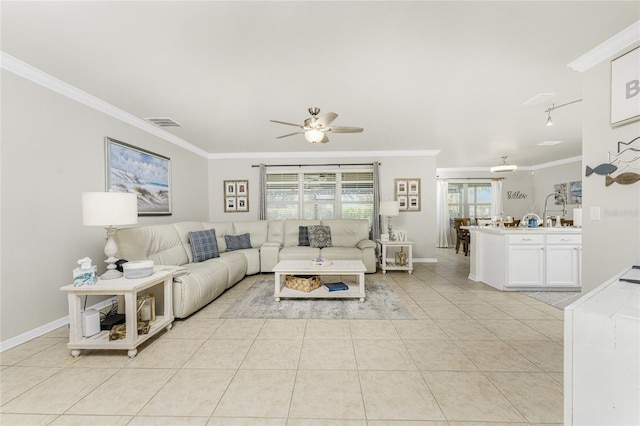 tiled living room featuring ceiling fan and crown molding