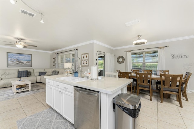 kitchen with sink, ceiling fan, an island with sink, white cabinets, and dishwasher