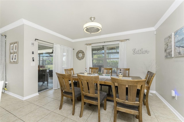 dining room with light tile patterned floors and ornamental molding