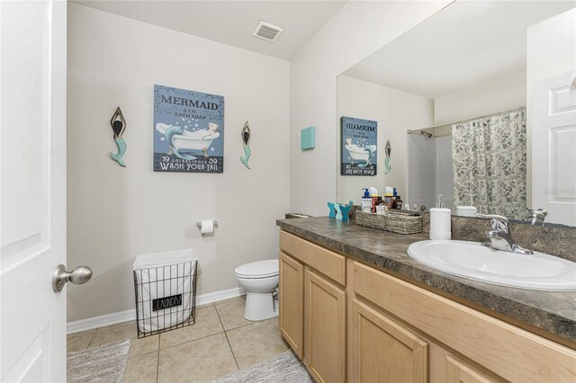 bathroom featuring vanity, tile patterned floors, toilet, and a shower with shower curtain