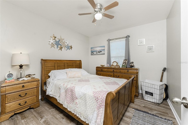 bedroom featuring ceiling fan and wood-type flooring