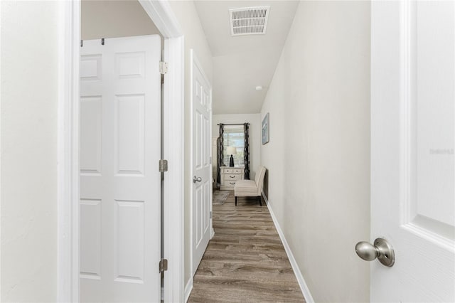 hallway featuring wood-type flooring