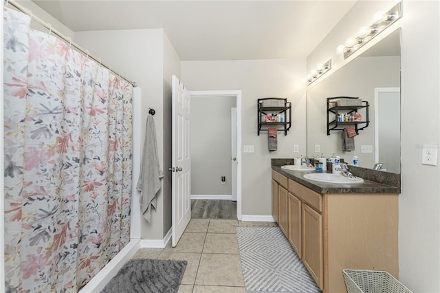 bathroom featuring tile patterned flooring, vanity, and a shower with curtain