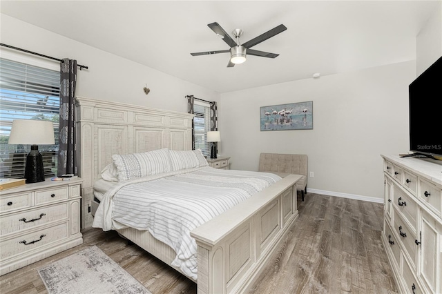 bedroom with ceiling fan and light wood-type flooring