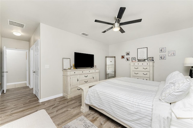 bedroom with light wood-type flooring and ceiling fan