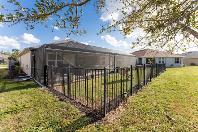 view of yard featuring glass enclosure