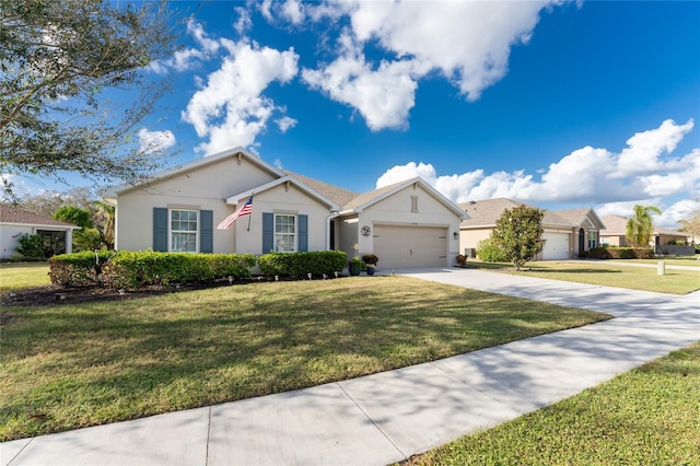 single story home with a garage and a front lawn