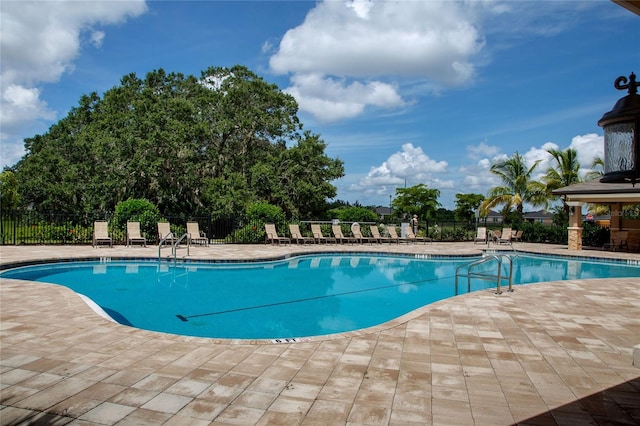 view of swimming pool featuring a patio area