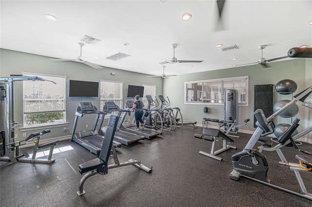 exercise room with ceiling fan