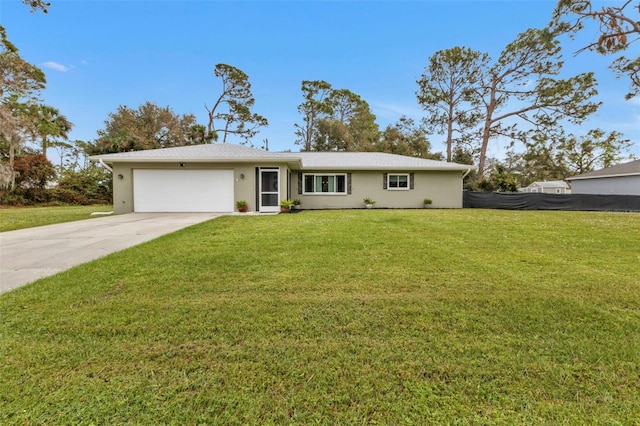 ranch-style home featuring a garage and a front yard