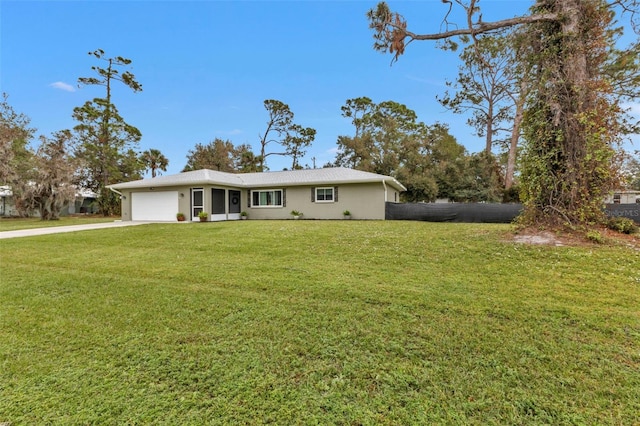 single story home with a front yard and a garage