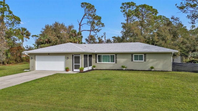 ranch-style home with a garage and a front yard