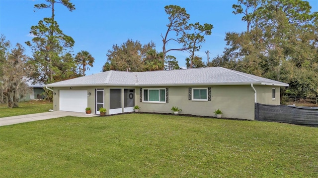 ranch-style house with a front yard and a garage