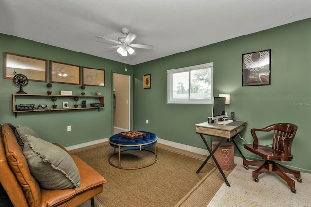 living area with ceiling fan