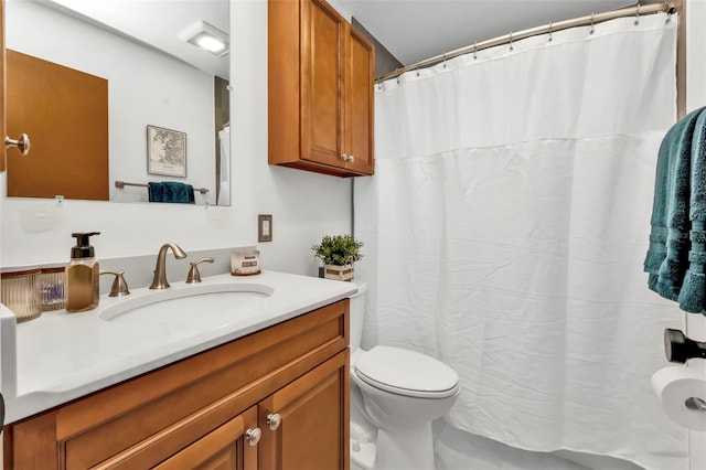 bathroom with toilet and vanity