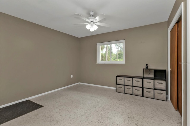 unfurnished bedroom featuring ceiling fan