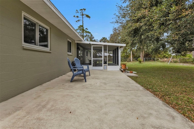 view of patio featuring a sunroom