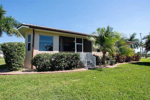 exterior space featuring a lawn