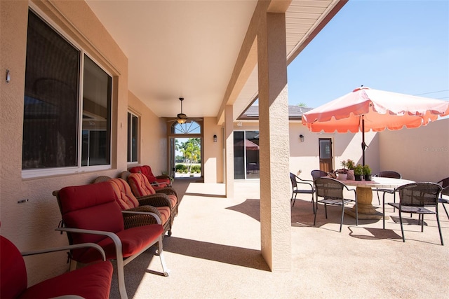 view of patio / terrace featuring ceiling fan and an outdoor hangout area