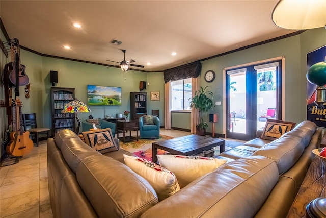 tiled living room featuring ornamental molding, french doors, and ceiling fan