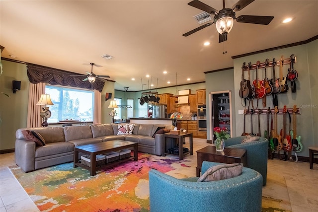 living room featuring ceiling fan and ornamental molding