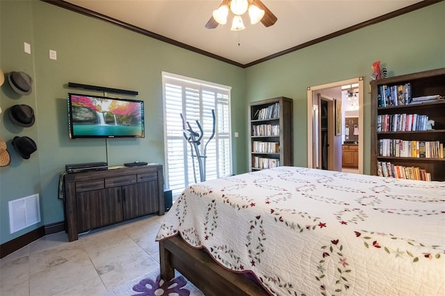 tiled bedroom with ensuite bath, ornamental molding, and ceiling fan