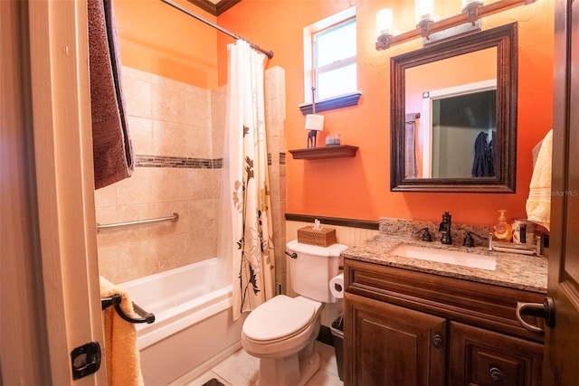 full bathroom featuring vanity, shower / tub combo with curtain, toilet, and tile patterned flooring