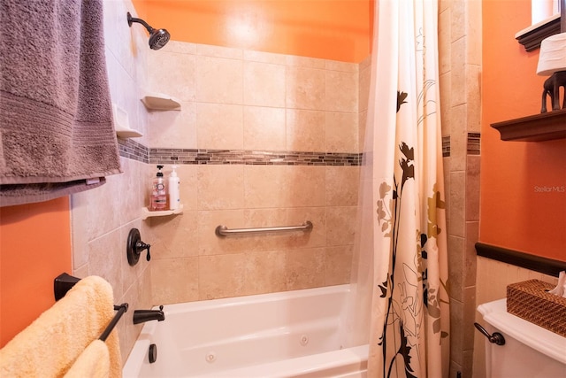 bathroom featuring toilet and shower / bath combo