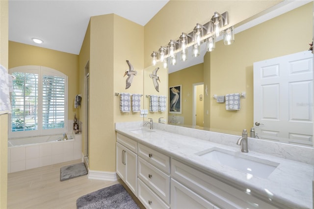 bathroom featuring vanity, hardwood / wood-style floors, and independent shower and bath