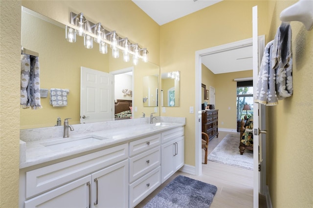 bathroom featuring vanity and hardwood / wood-style floors