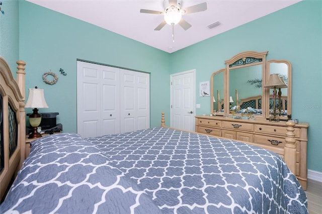 bedroom featuring a closet, wood-type flooring, and ceiling fan