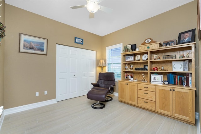 sitting room featuring ceiling fan and light hardwood / wood-style flooring