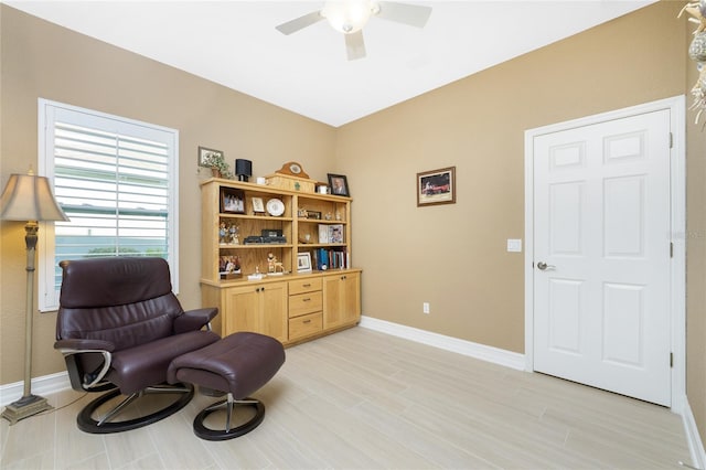 sitting room featuring light hardwood / wood-style flooring and ceiling fan