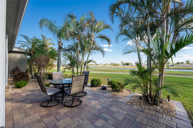 view of patio with a water view