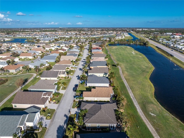 drone / aerial view with a water view